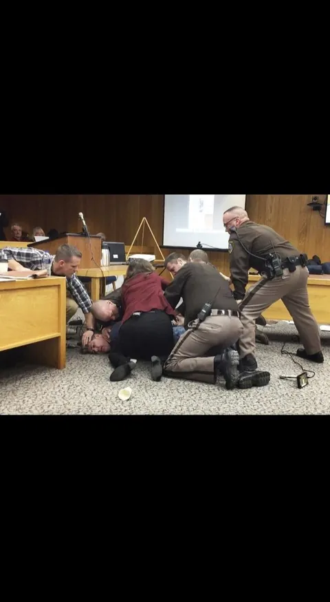 After hearing how Larry Nassar abused hundreds of young athletes, a father of three victims tried to attack him in court, shouting that he wanted “five minutes alone".