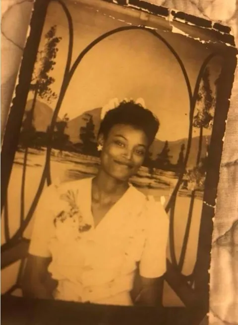 Photo simply marked "Dora", found on a Milwaukee street. Posting in hopes of finding who this beautiful photo belongs to.