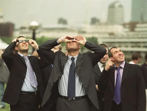In 1999 London City workers shielded their eyes to view the solar eclipse, while Barry on the right protected his ear.