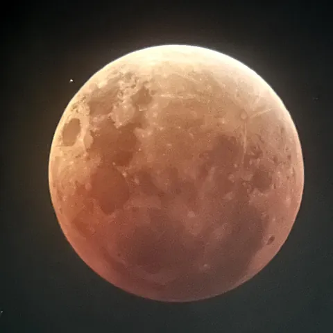 Star and Moon during Total Lunar Eclipse
