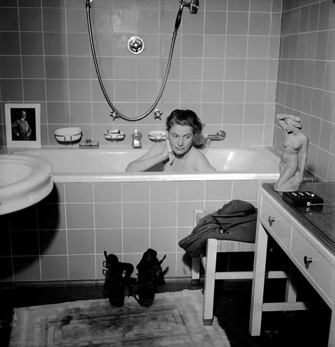 Vogue photographer Lee Miller bathing in Hitler's private apartment in Munich, 1945. She had just come from documenting the liberation of Dachau.