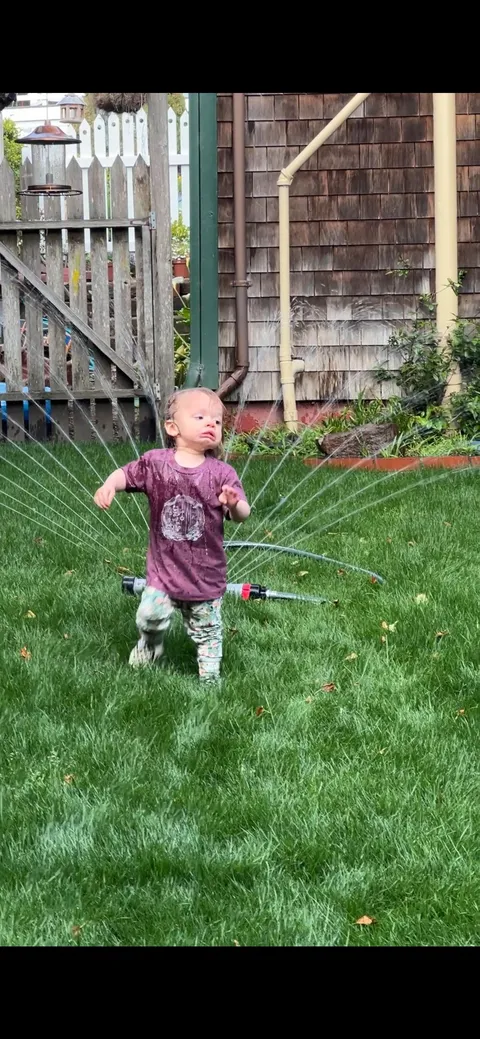 My daughter’s first encounter with a sprinkler.. She happily ran right back to it after getting hit