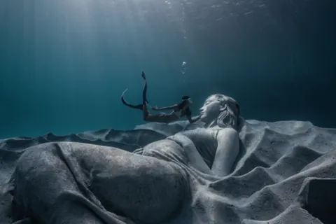 "Ocean Gaia", Japan's first underwater sculpture, weighing over 45 tons and 5.5 meters wide, created by British sculptor Jason deCaires Taylor, featuring Japanese model Kiko Mizuhara, resting 5 meters below the surface off the island of Tokunoshima, Japan, installed on October 14, 2025