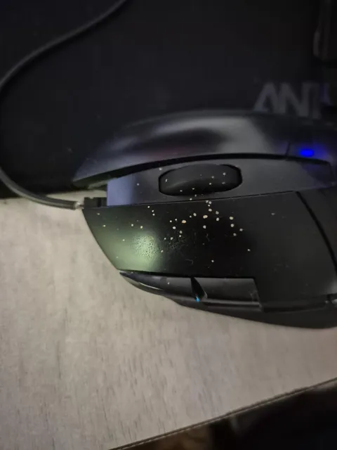What are these spots that appear on my mouse overnight? they are hard and bumpy in texture and can be scraped off. they weren't there yesterday evening, but they are here today morning