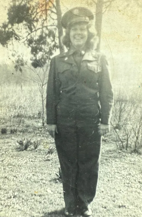 Grandmother in her brother’s Army uniform posing with her older sister, 1951