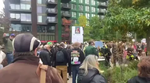 No Kings Day is officially underway! Hundreds have gathered outside the US embassy in London