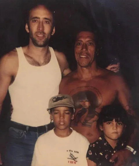 Nicolas Cage with Danny Trejo and his kids on the set of Con Air (1997)