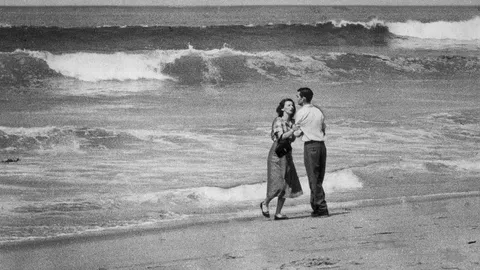 Tragedy by the Sea, 1954. Showing a married couple standing on a beach moments after learning their 19-month-old son disappeared