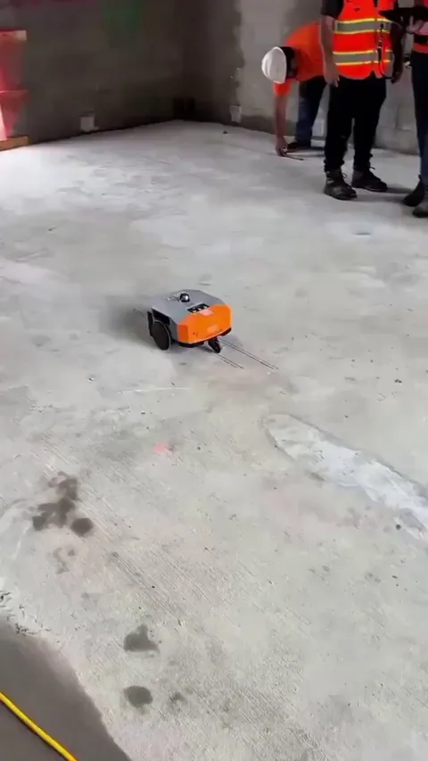 A small robot designed to automate construction layout by printing floor plans directly onto the ground in the building site.