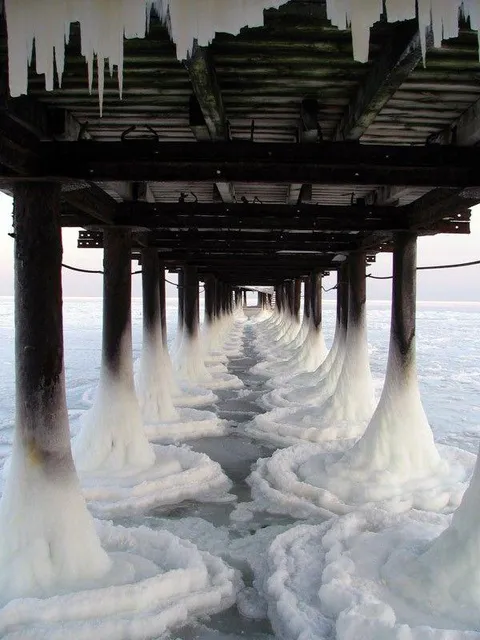 The way the ice forms under this pier