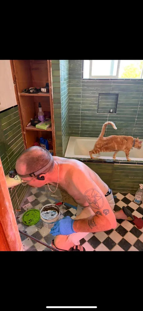 My husband and his cat remodeled our bathroom. He’s a tough foreman (the cat)
