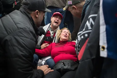 PsBattle: Trump supporters receive aid after tear gas was deployed at rioters storming the U.S. Capitol...