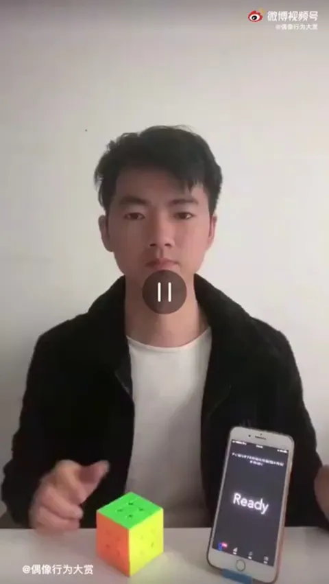 Man trying to solve a Rubik's Cube blindly, but in a different way