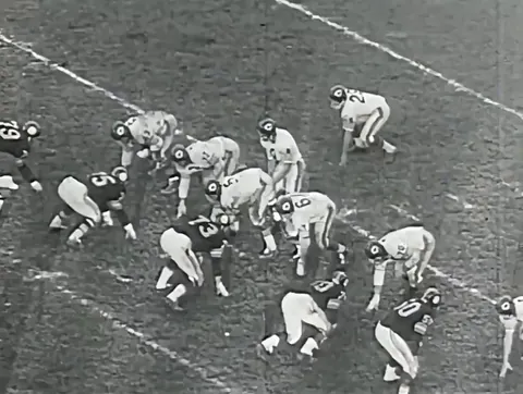 Mike Ditka, treating defenders like they're bowling pins
