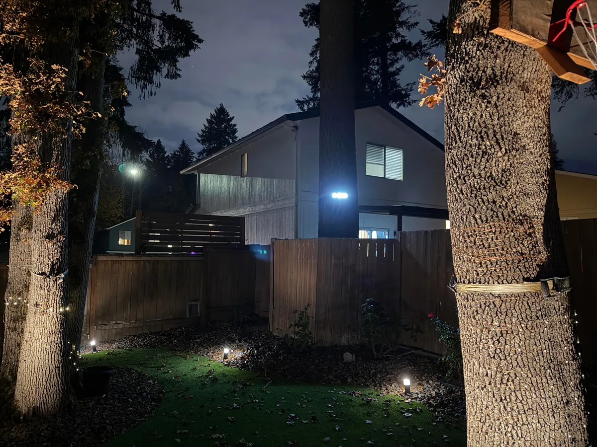 Neighbor installed a motion sensing LED light on a tree and aimed directly into my yard