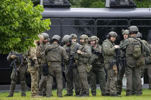 Law enforcement officers and the FBI near the scene of a shooting in Brooklyn Park, Minnesota, US