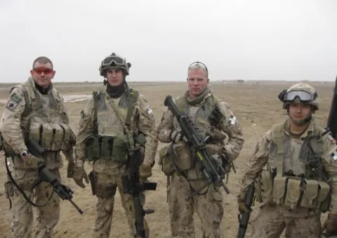 Just 4 Canadians (me on the far right) doing nothing for the USA in Kandahar, Afghanistan (2009).