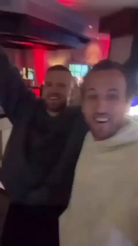 Harry Kane and Eric Dier celebrating after winning the Bundesliga