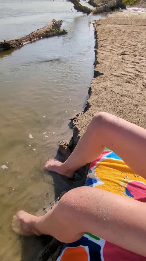 Topless on a public sandbar