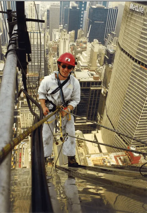 Checking the steel spire of the Chrysler Building for water leaks, New York