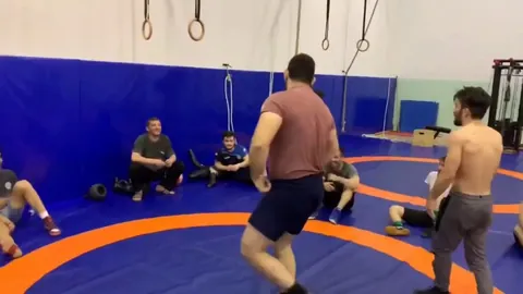 125lb (57 kg) Greco Roman wrestler reverse lifts a 285lb (129 kg) man off the ground