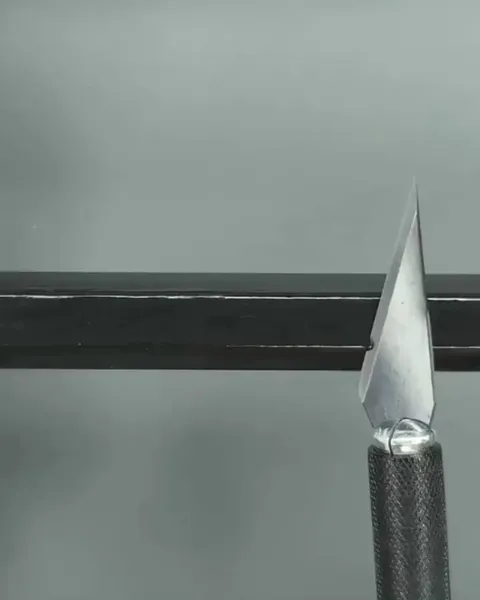 Carving a text logo on a pencil lead