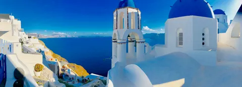 My lovely Airbnb view in Santorini!! Blocked off to the public but I can venture out and sit underneath the blue domes.