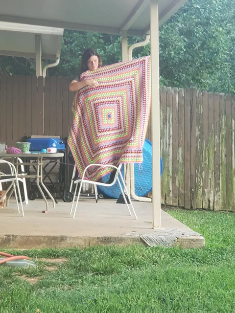 My neighbor hollered over at me to show me her completed crotchet blanket she made for her sister going back to college. She too cute also telling me of all the colors she used.