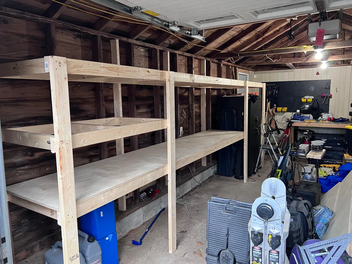 Completed a weekend project! Shelves and a workbench built into my garage.