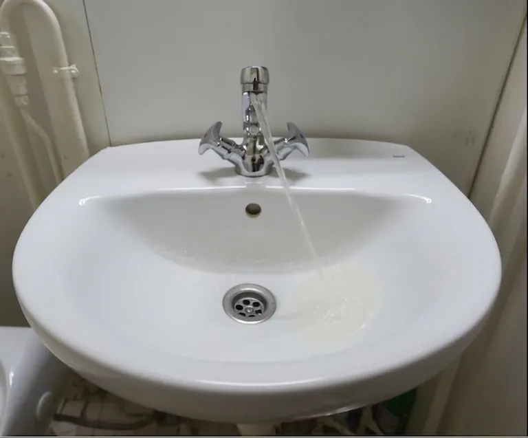 The tilt of the cruise ship makes it look like the water isn't obeying the law of gravity.