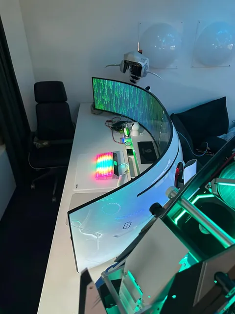 an open-air build with two ultrawide monitors