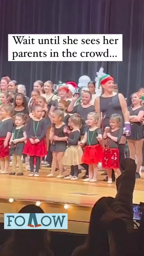Little girl tears up when she sees her parents in the audience