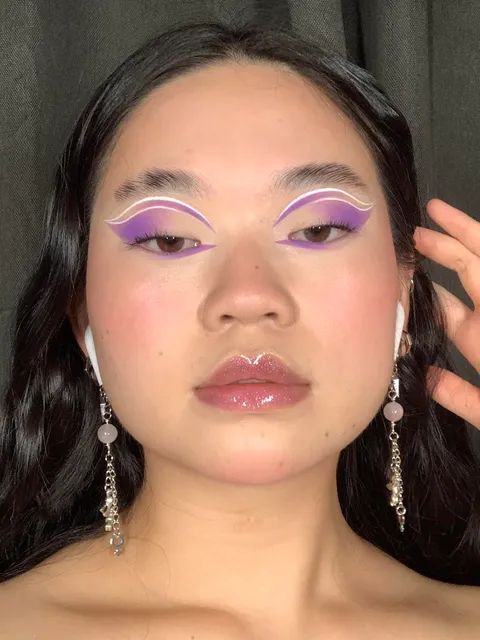 Purple cut crease with some graphic liner