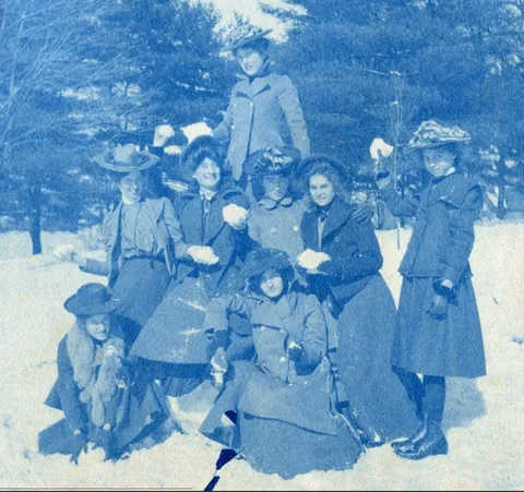 An unnamed young woman recorded her senior year at Asheville Female College in a photo album, Asheville, North Carolina, 1902. It includes a dorm room, group shots of friends, playing in snow, a visit to the mountains, their final midnight party before graduation, and graduation day itself.