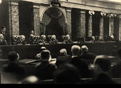 Illegal picture taken inside the US Supreme Court in 1932. Dr. Erich Salomon faked a broken arm so he could hide a camera in his cast.
