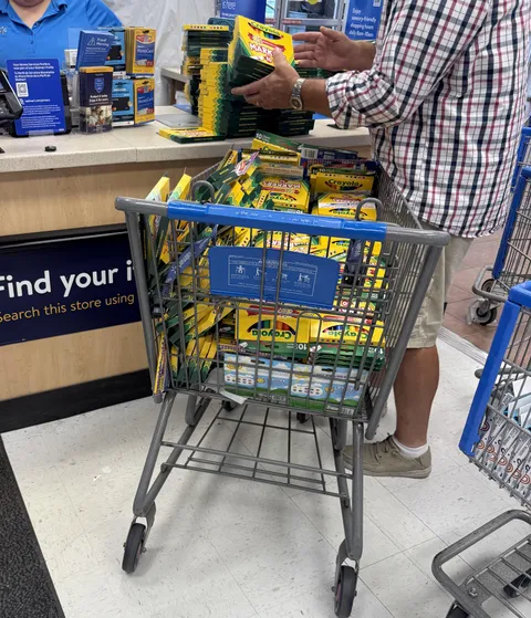 Guy with three carts of markers in the return line. It took both associates they had to count and check each box.