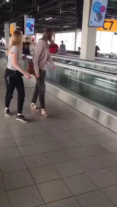 Four men having a little fun at an airport.😃