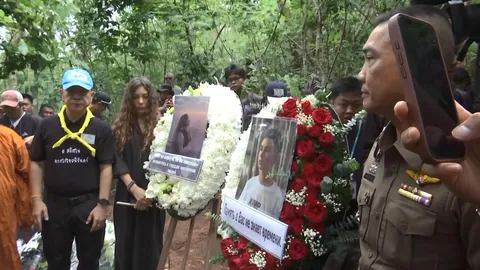 Russian Family Holds Buddhist Memorial Ceremony at Site Where Bodies Were Found