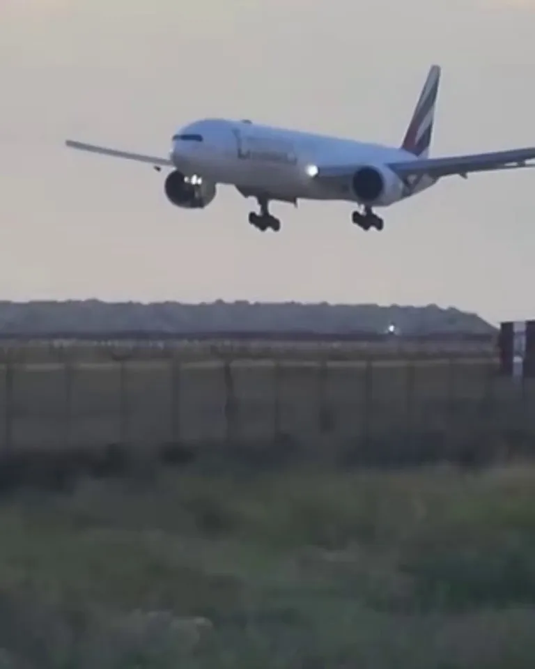 Mom watching her Son flying his first Emirates flight and landing in his hometown for the first time