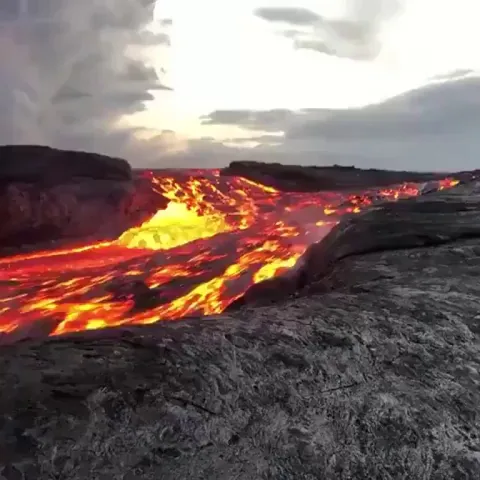 Incredible close-up of fast flowing river of lava flowing from Kilauea volcano in Hawaii