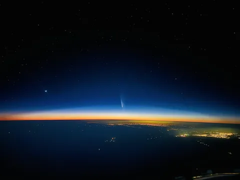 ITAP of a city, a sunset, a comet