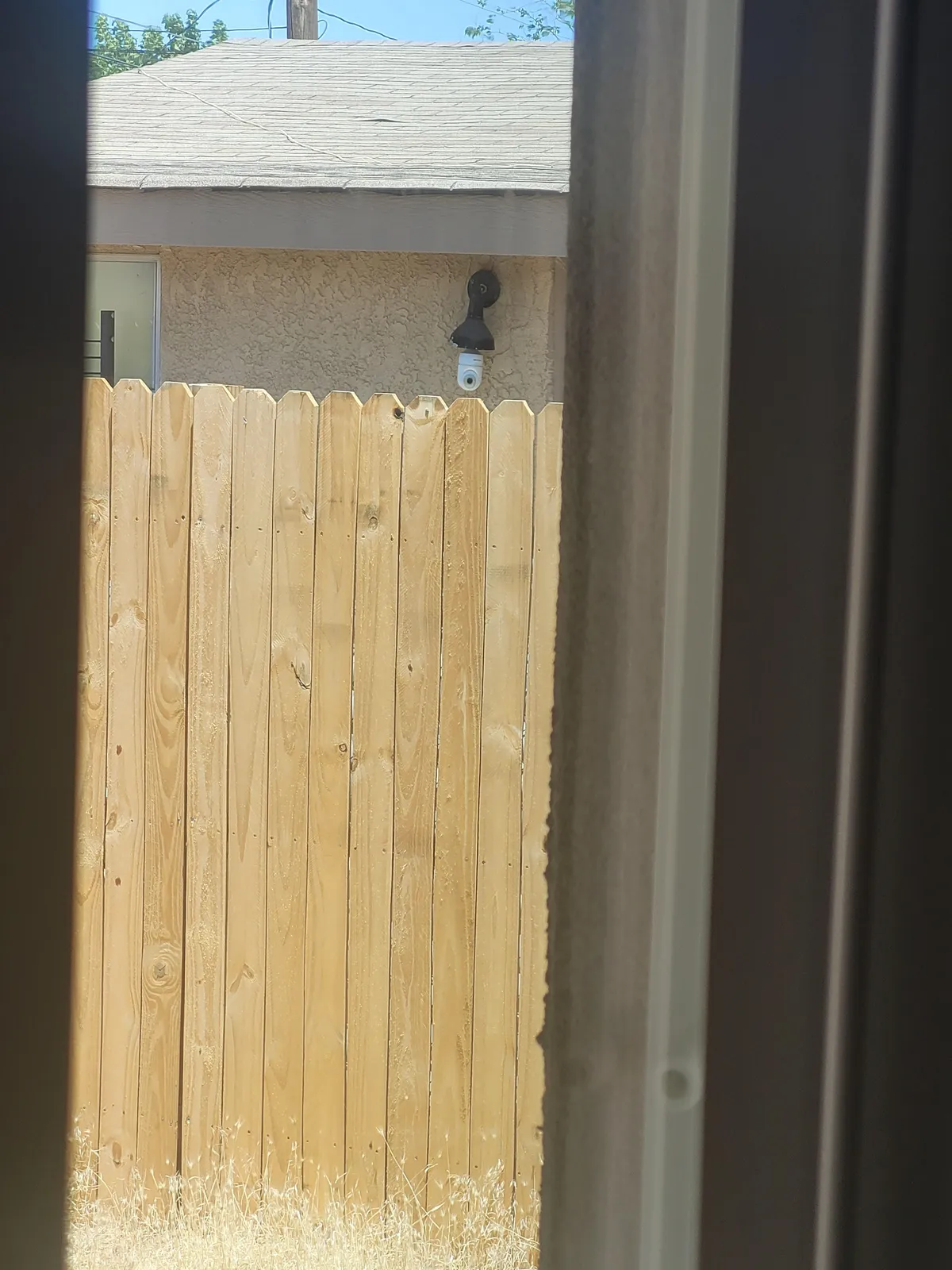 My neighbor keeps her camera pointed straight at my back door.
