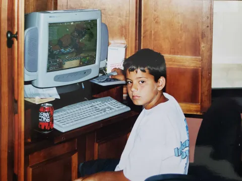 Me playing Age of Empires II on the family desktop with Cherry Coke at the ready, as always. Circa 2001.