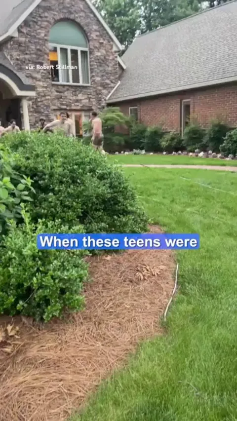 A bunch of dudes invite a UPS driver to join them on their slip and slide, on a hot day