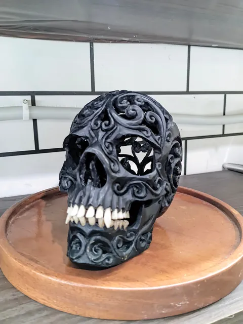 I made a skull carving from ebony wood, the teeth are made from cow bone