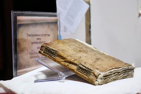 A 500-year-old manuscript bound in human back skin, displayed in Kazakhstan. Out of 330 pages, only 10 have been deciphered. The rest remains a mystery.