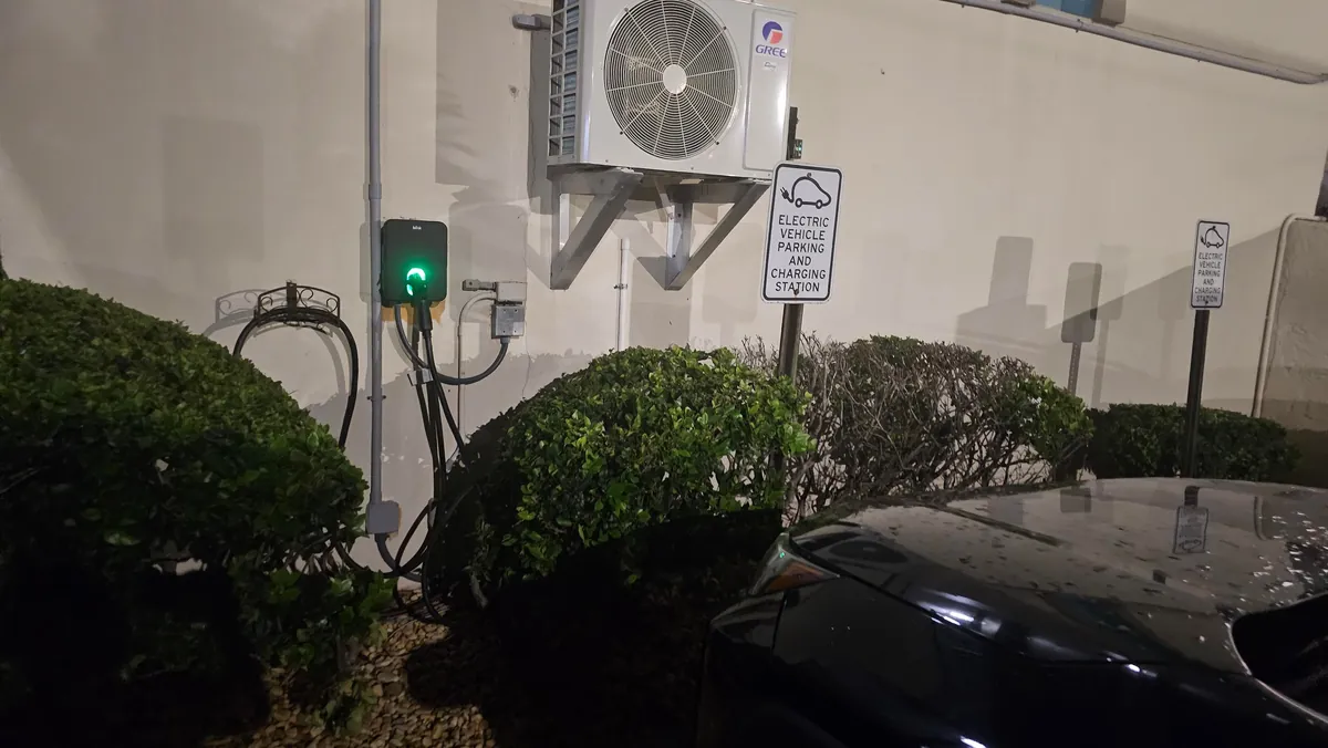 Three ICE Cars Taking Up The Three Electric Charging Spots At The Hotel