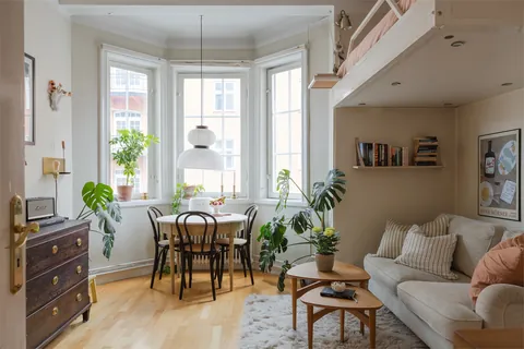 Studio apartment with a large bay window and a loft bed in a 1912 building, Södermalm, Stockholm City Centre, Sweden [1680x1120]