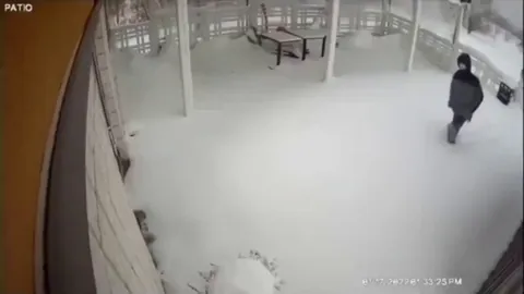 Guy walks to a restaurant in the snow just to find out that its closed