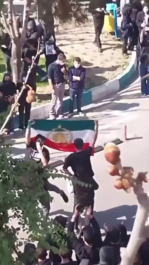 University students in Tehran today waive the Lion and Sun Flag. Protesters carrying this flag or participating in related demonstrations are often charged with "moharebeh" (waging war against God) which carries the penalty of death or amputation